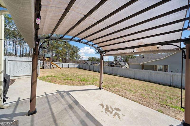 view of patio with a playground, a fenced backyard, and a pergola