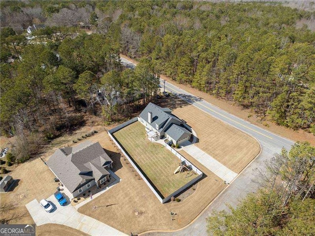 aerial view with a wooded view