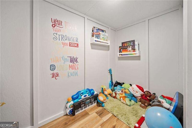 recreation room with wood finished floors