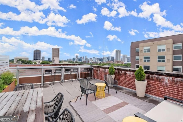 view of patio / terrace featuring a balcony and a city view