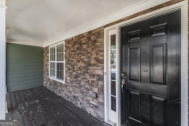 entrance to property with stone siding