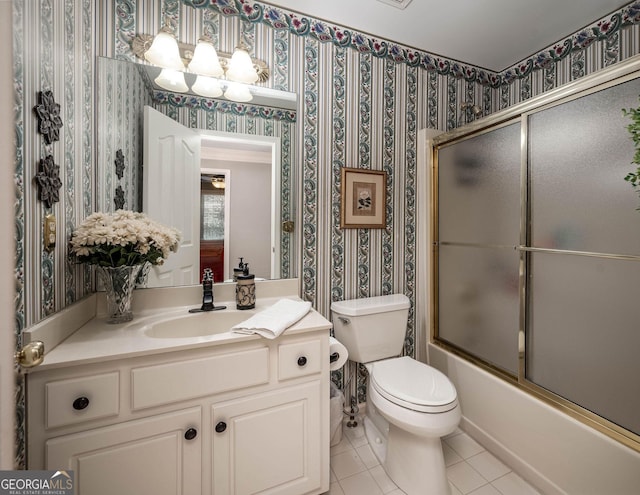 full bath featuring toilet, wallpapered walls, shower / bath combination with glass door, and vanity