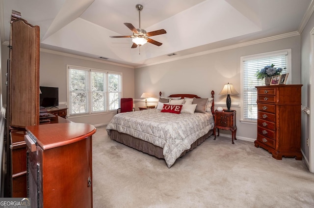 bedroom featuring a raised ceiling, visible vents, ornamental molding, light carpet, and baseboards