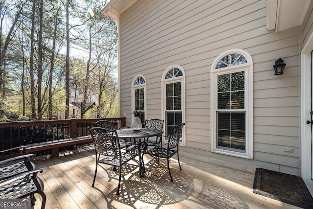 deck featuring outdoor dining area