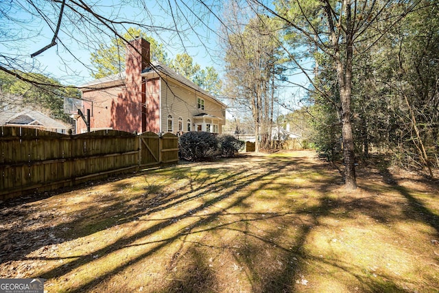 view of yard featuring a gate and fence