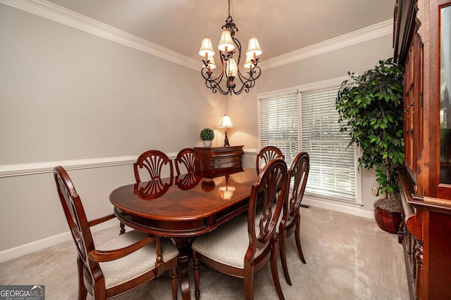 dining space with light colored carpet, crown molding, baseboards, and an inviting chandelier