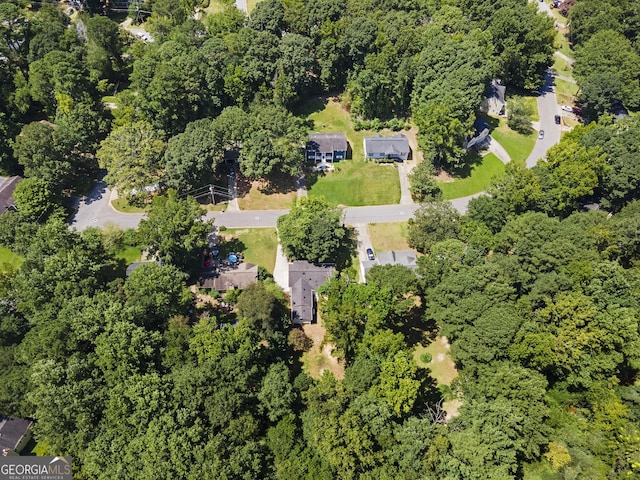 drone / aerial view featuring a view of trees