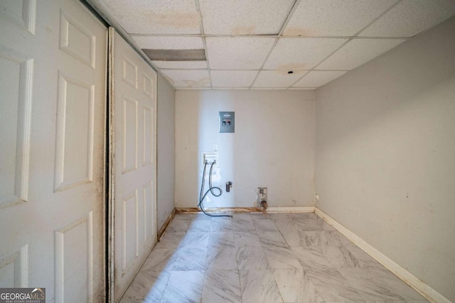 washroom with hookup for a washing machine, laundry area, and baseboards