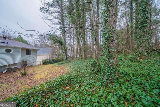 view of yard with central AC