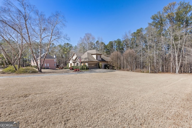 view of front of property with a garage and concrete driveway