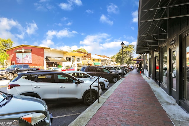 uncovered parking lot featuring a residential view