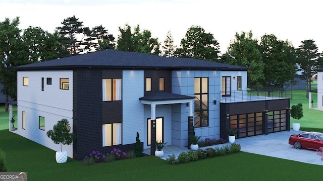 contemporary home with driveway, a front lawn, and an attached garage