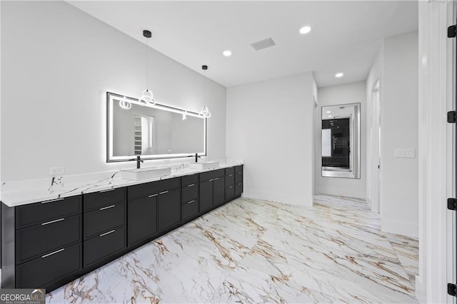 full bathroom with marble finish flooring, double vanity, recessed lighting, and baseboards
