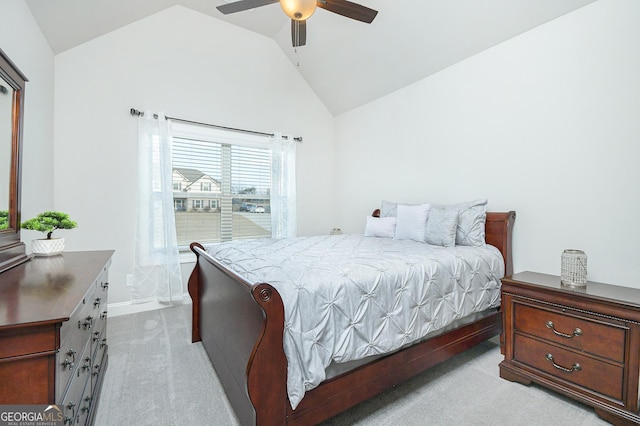 bedroom featuring lofted ceiling, a ceiling fan, and light colored carpet