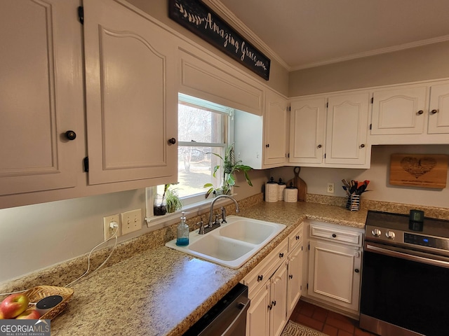 kitchen with white cabinets, ornamental molding, stainless steel appliances, light countertops, and a sink