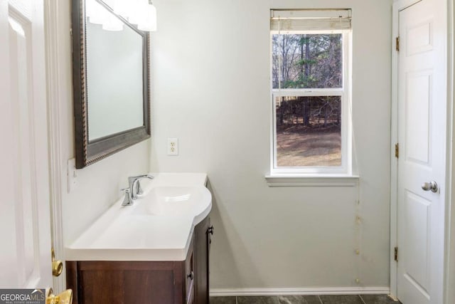1004 Hamilton Dr, Locust Grove, GA 30248 - bathroom featuring baseboards and vanity
