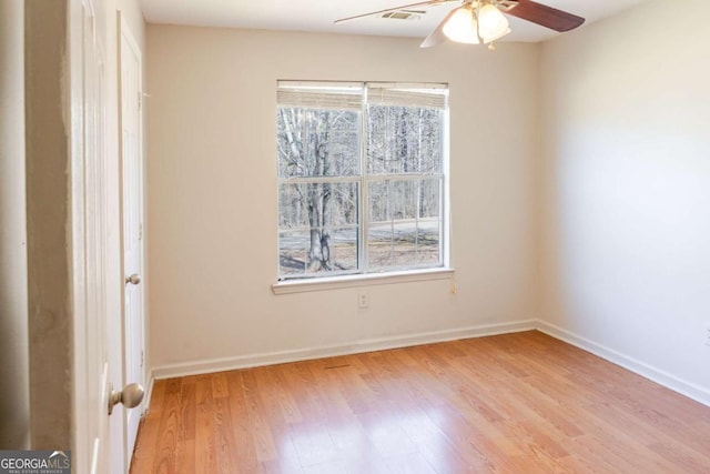 1004 Hamilton Dr, Locust Grove, GA 30248 - empty room featuring light wood-type flooring, baseboards, visible vents, and a ceiling fan