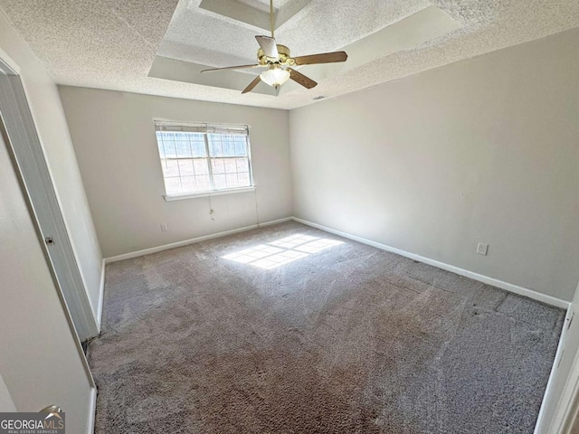 1004 Hamilton Dr, Locust Grove, GA 30248 - interior space with carpet floors, a raised ceiling, a ceiling fan, a textured ceiling, and baseboards