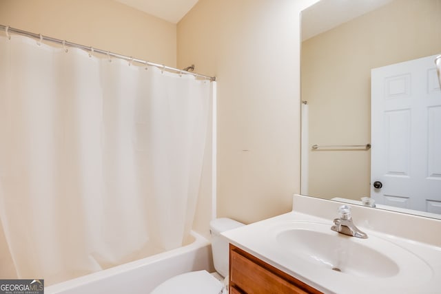 full bathroom featuring shower / bath combo with shower curtain, vanity, and toilet