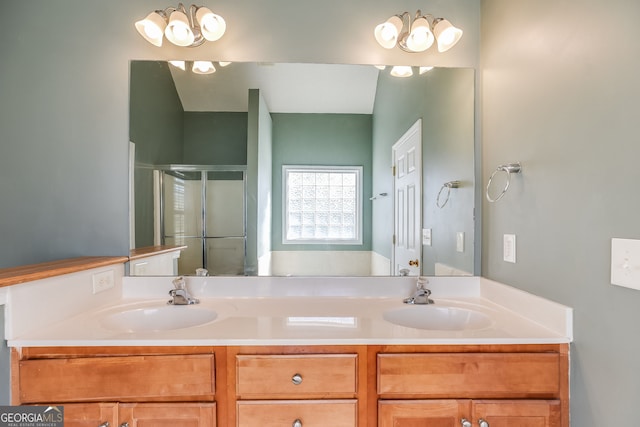 full bathroom featuring double vanity, a sink, and a shower stall