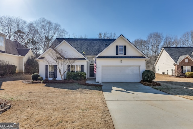 traditional-style house with driveway and a front yard