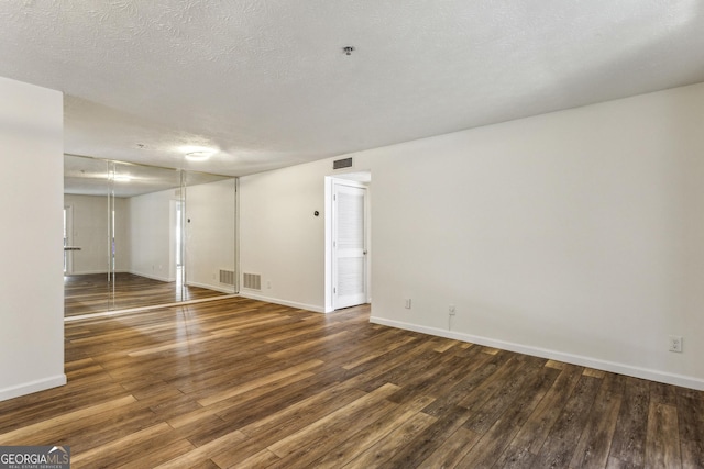 2701 Cumberland Ct SE, Smyrna, GA 30080 - empty room featuring baseboards, visible vents, and dark wood-style flooring