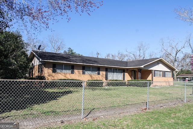 single story home with brick siding, a front lawn, and fence private yard