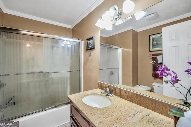 full bathroom with combined bath / shower with glass door, crown molding, vanity, and toilet