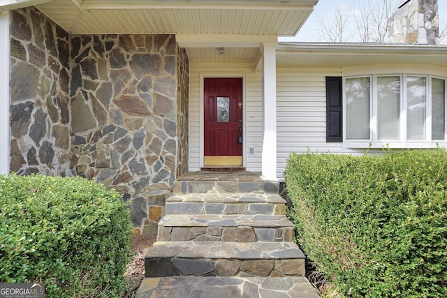 view of exterior entry with stone siding