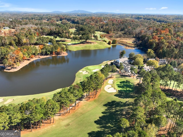 aerial view featuring view of golf course and a water and mountain view