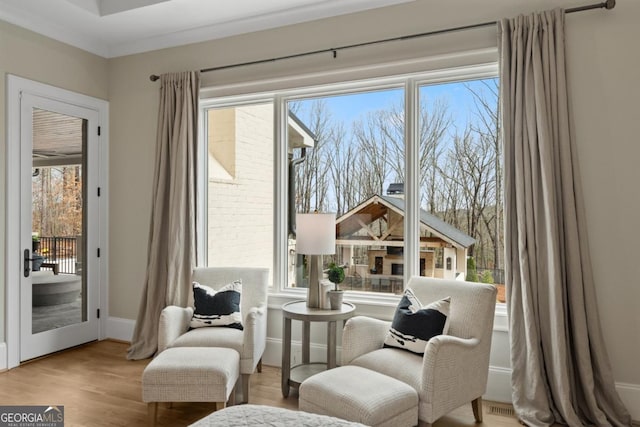 sitting room with light wood-style flooring and baseboards