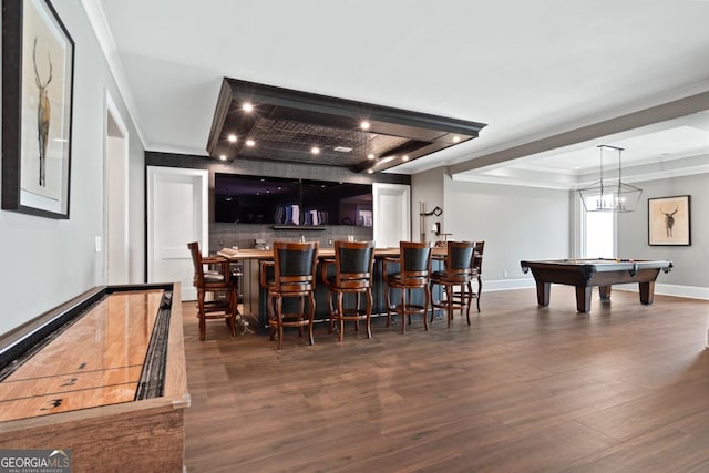 bar featuring baseboards, backsplash, dark wood finished floors, and bar