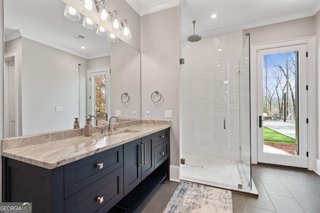 bathroom with visible vents, ornamental molding, tile patterned flooring, vanity, and a shower stall