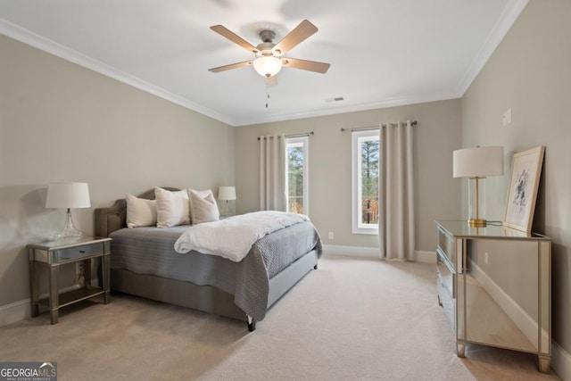 bedroom with light colored carpet, crown molding, visible vents, and baseboards