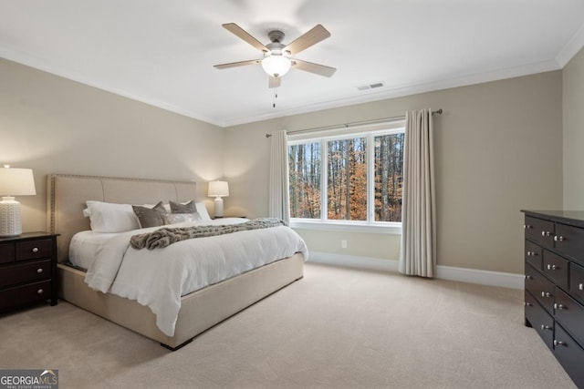 bedroom featuring crown molding, light colored carpet, visible vents, ceiling fan, and baseboards