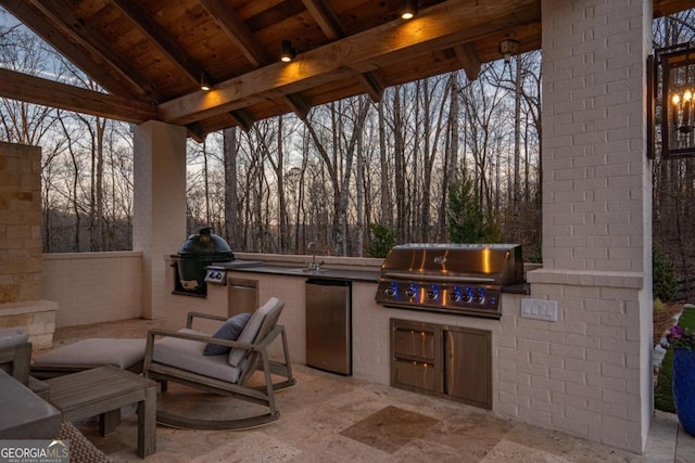 view of patio featuring exterior kitchen and grilling area