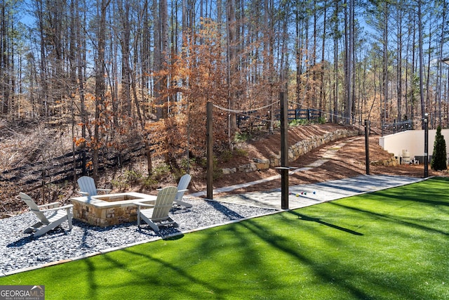 view of yard featuring a fire pit