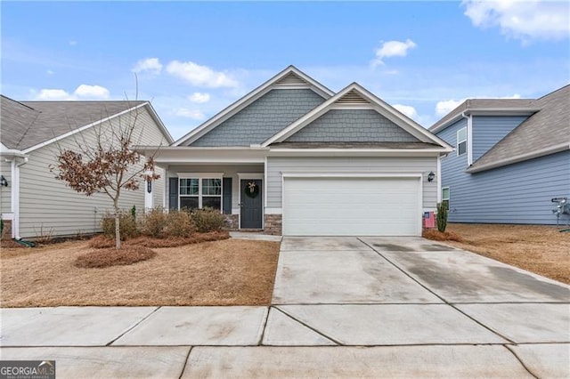 craftsman-style house featuring a garage and driveway