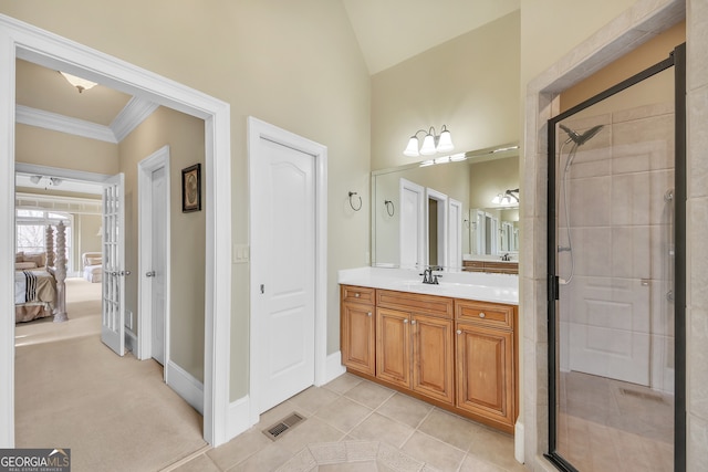 bathroom featuring visible vents, ornamental molding, a stall shower, vanity, and ensuite bath