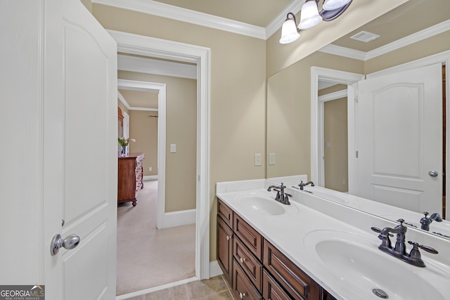 full bathroom featuring crown molding, visible vents, and a sink