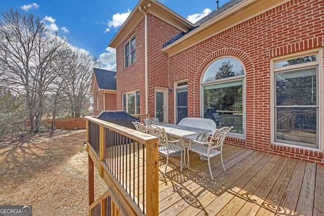 deck with outdoor dining area