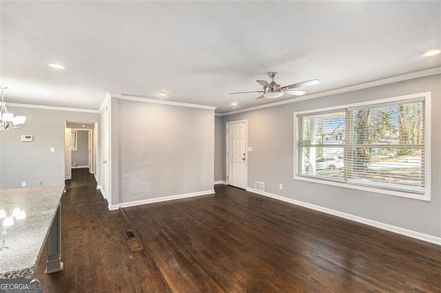 empty room featuring recessed lighting, dark wood-style flooring, baseboards, and ceiling fan with notable chandelier