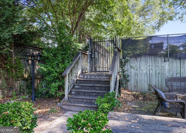 wooden deck with fence and stairway