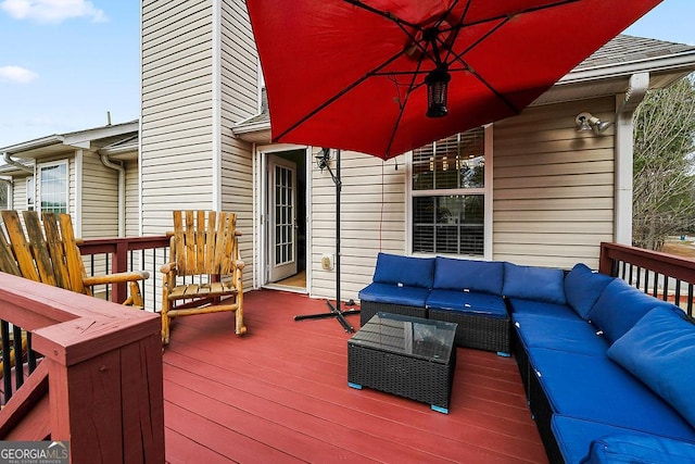 wooden deck with an outdoor hangout area