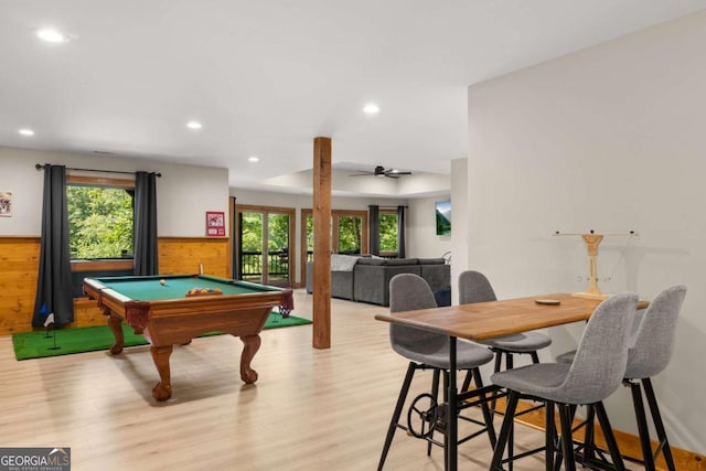 playroom with light wood-type flooring, plenty of natural light, recessed lighting, and wainscoting