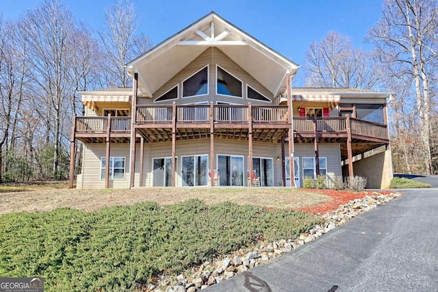 rear view of property featuring a deck