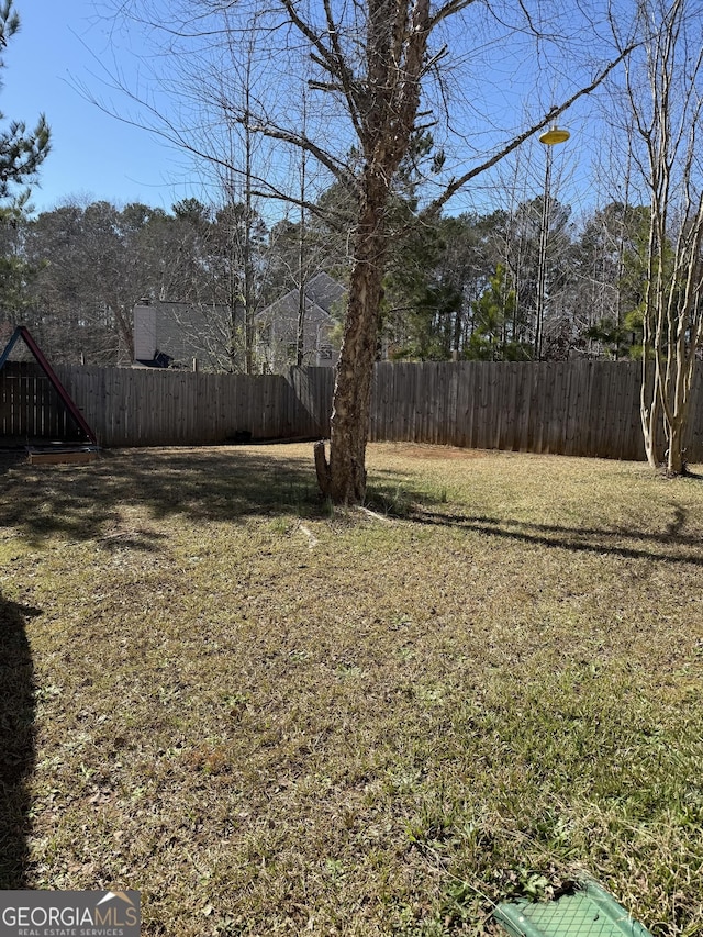 view of yard featuring fence