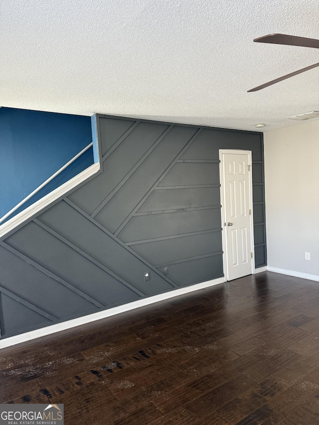 garage with baseboards and a decorative wall