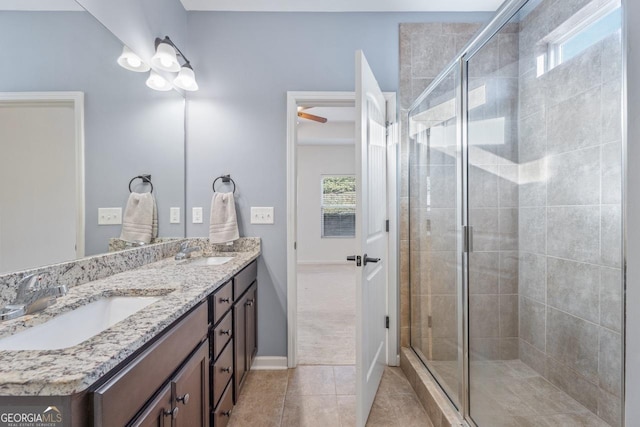 bathroom with plenty of natural light, tile patterned flooring, and a sink