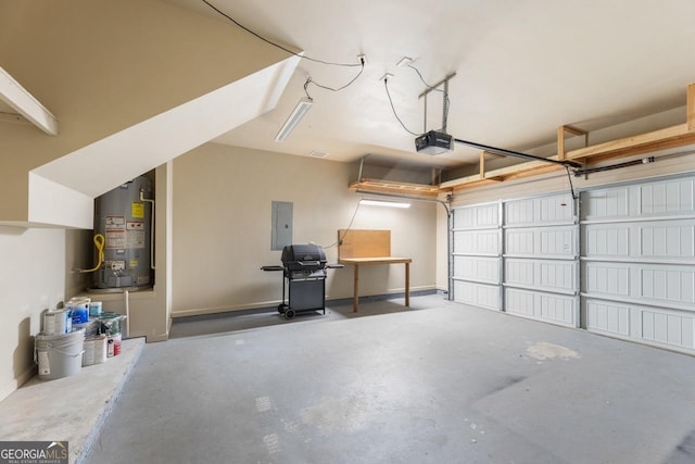 garage featuring a garage door opener, gas water heater, and electric panel